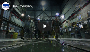 Hecla-Footer-one-company@2x photo of Hecla miners walking.