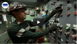 Hecla-Footer-were-hecla@2x Image of Hecla miner using controls.