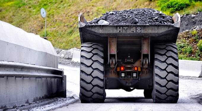 A truck carrying rocks and dirt
